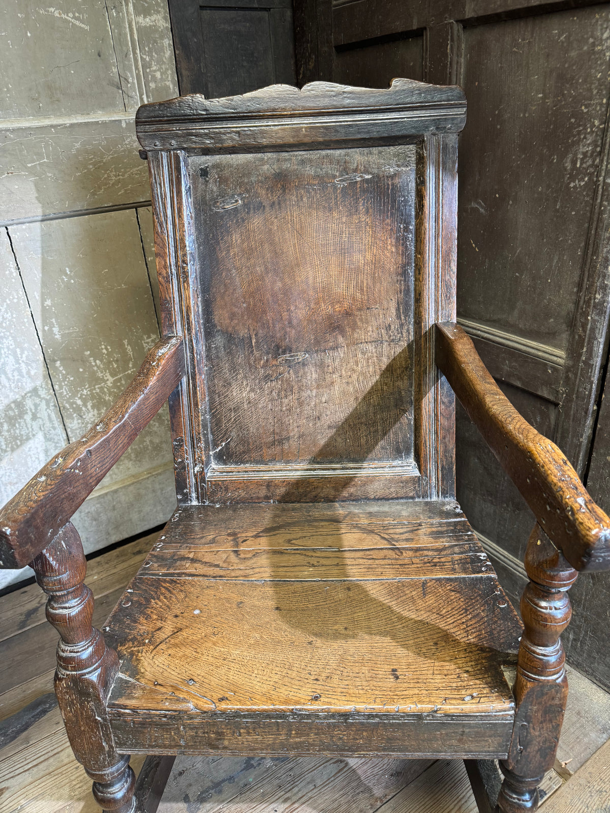 A North country 17th century oak wainscot armchair of excellent colour
