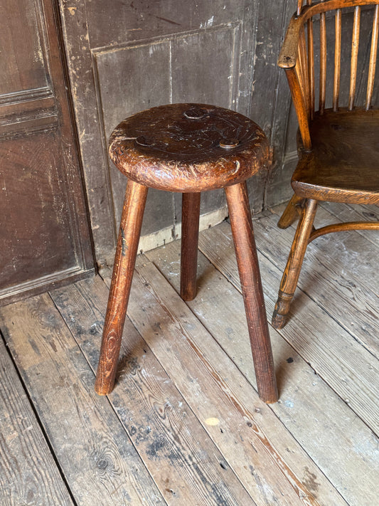 A good size 19th century elm top stool