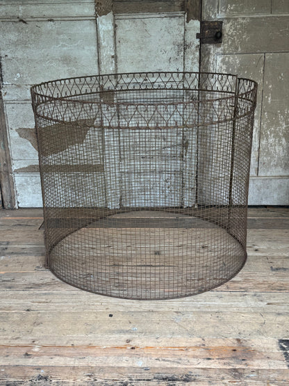 A mid century wire tree guard