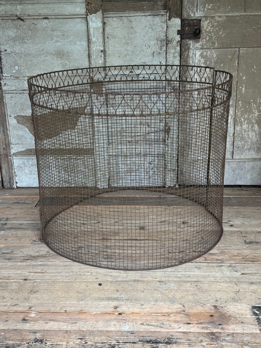 A mid century wire tree guard
