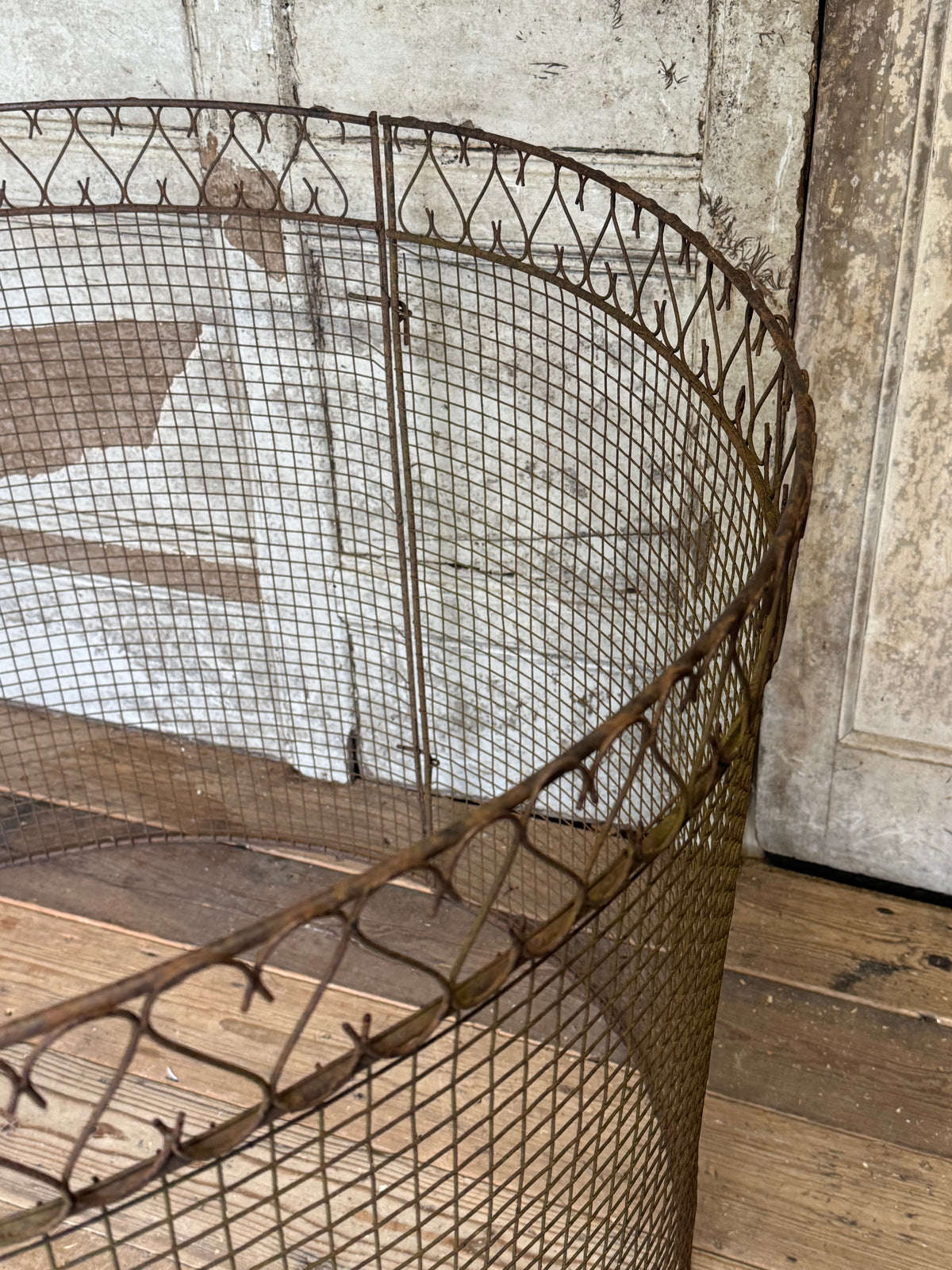 A mid century wire tree guard