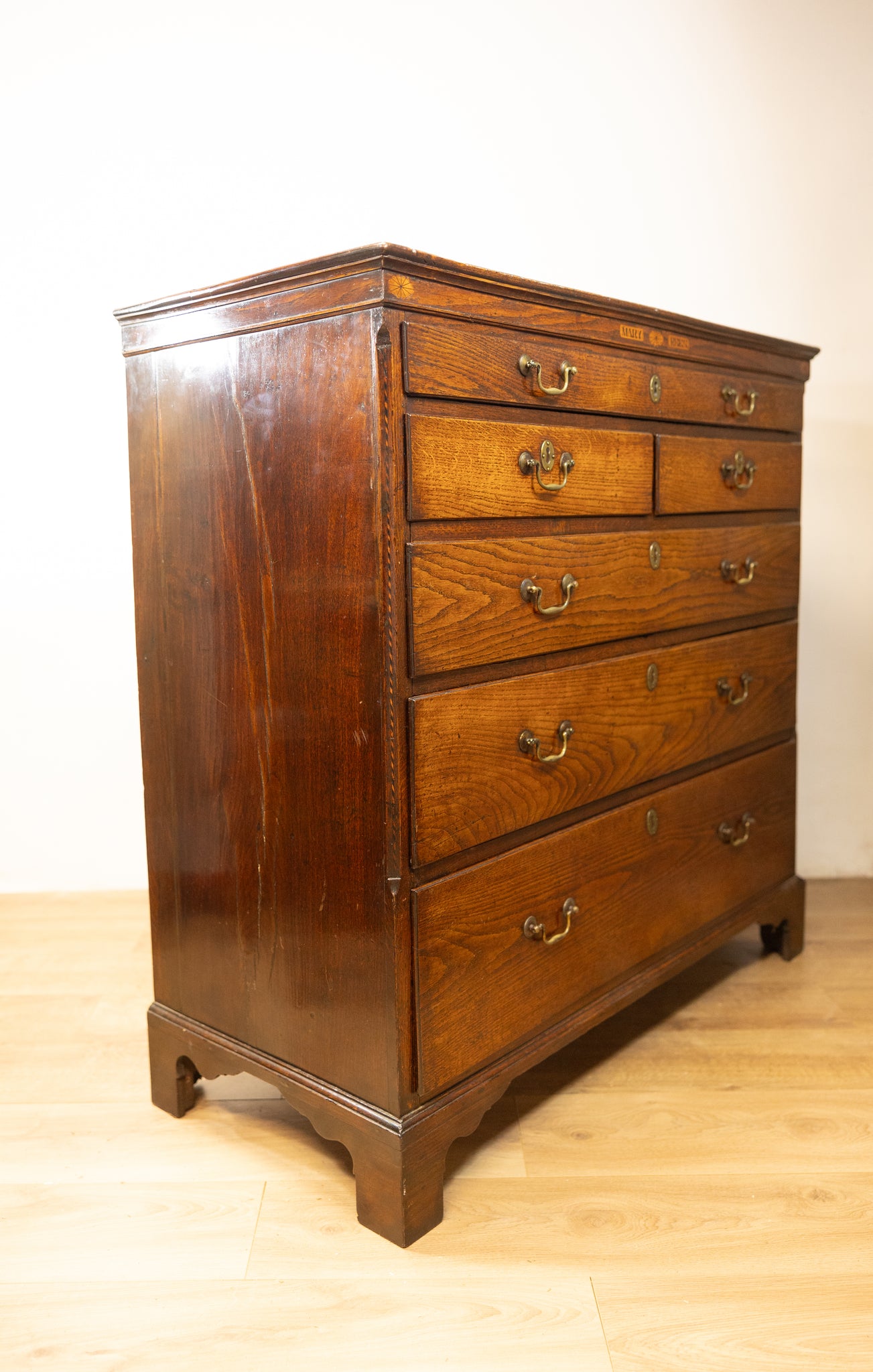 An unusual George III oak North Country oak chest of drawers with inset name 'Mary Rees'