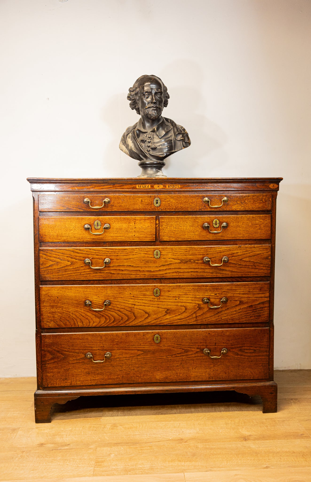 An unusual George III oak North Country oak chest of drawers with inset name 'Mary Rees'