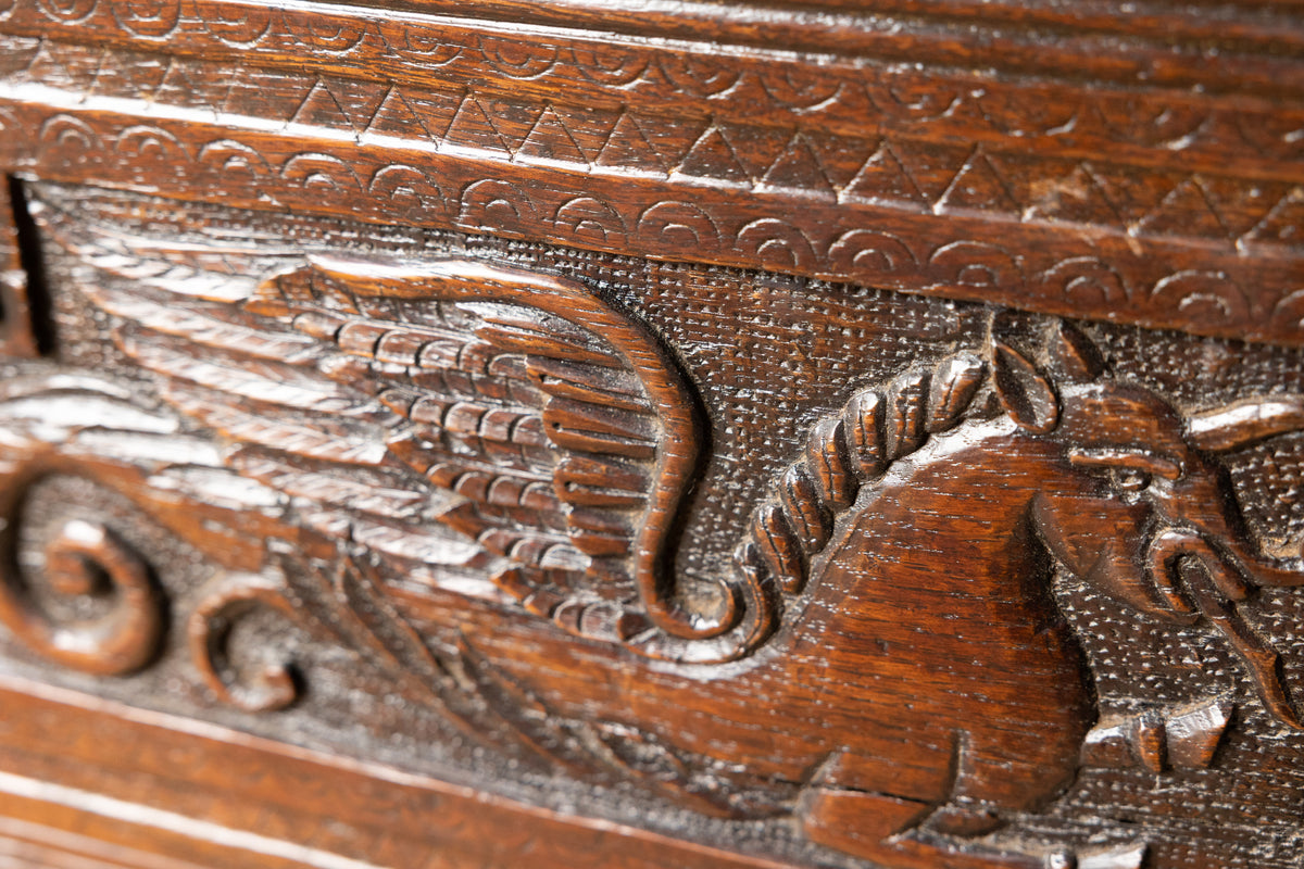 An  Elizabethan carved oak boarded chest with winged fantastic beasts, english, probably West Country, circa 1570–90