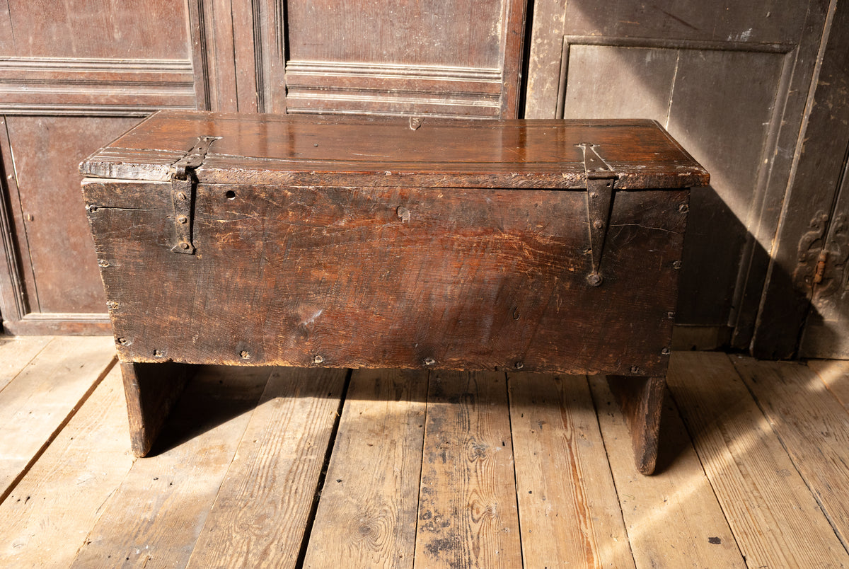 An  Elizabethan carved oak boarded chest with winged fantastic beasts, english, probably West Country, circa 1570–90