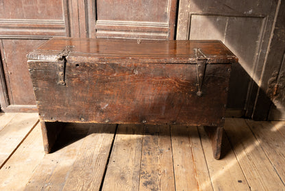 An  Elizabethan carved oak boarded chest with winged fantastic beasts, english, probably West Country, circa 1570–90