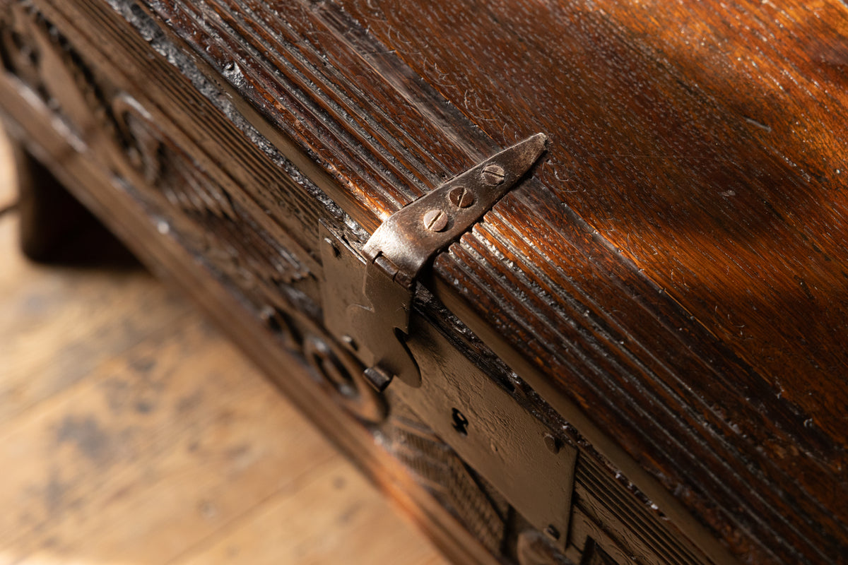 An  Elizabethan carved oak boarded chest with winged fantastic beasts, english, probably West Country, circa 1570–90