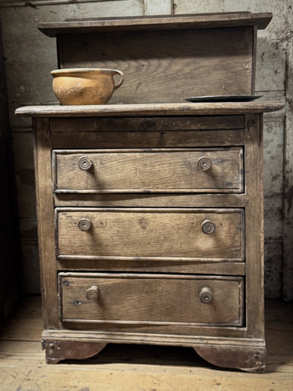 A small early 19th century primiitve oak scullery or servants' quarters chest of drawers