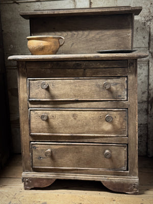 A small early 19th century primiitve oak scullery or servants' quarters chest of drawers