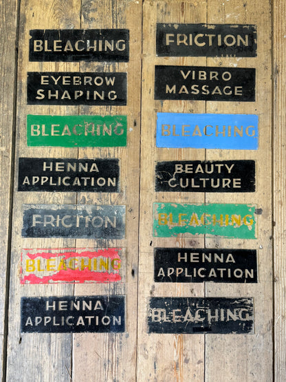 An unusual collection of fourteen reverse-painted glass signs from a hairdressing and beauty establishment c. 1930s/1940s