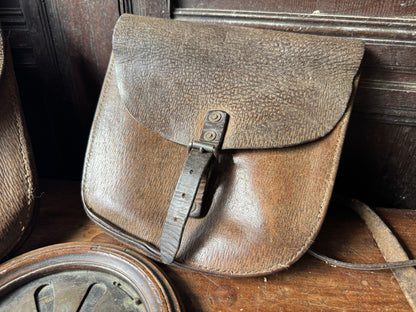 A pair of early 20th century leather despatch-type shoulder bags with original straps