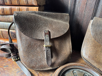 A pair of early 20th century leather despatch-type shoulder bags with original straps