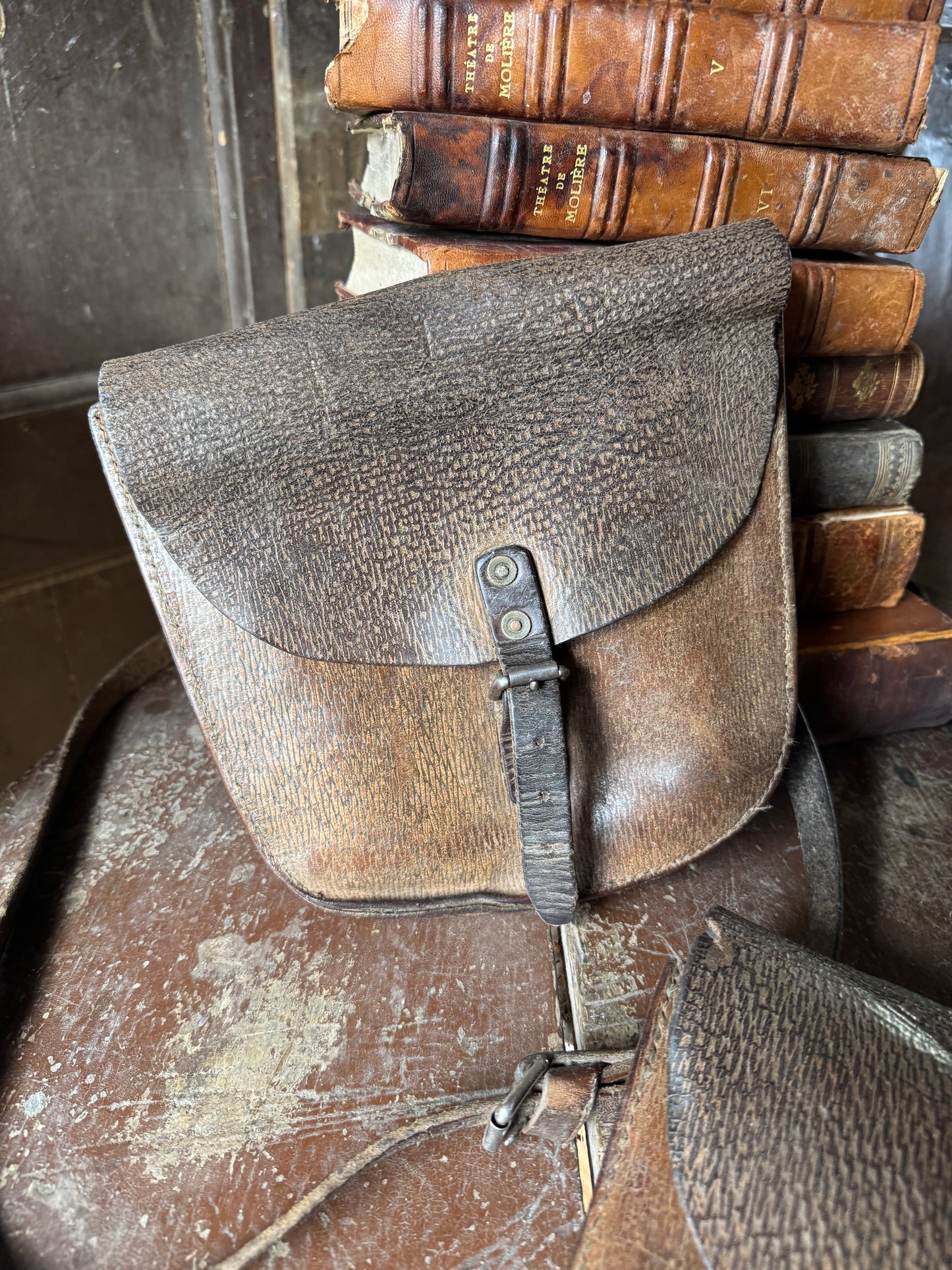 A pair of early 20th century leather despatch-type shoulder bags with original straps