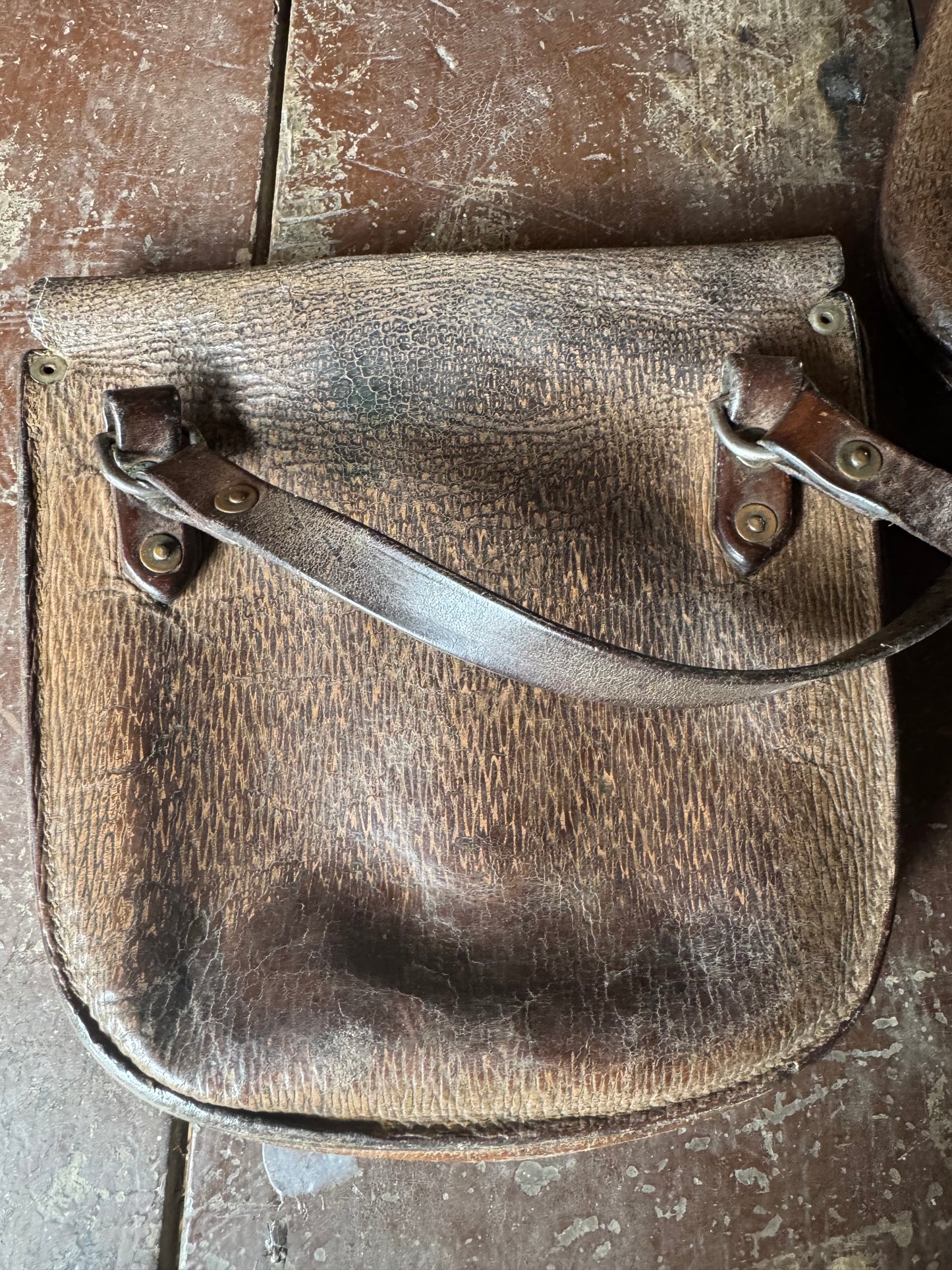 A pair of early 20th century leather despatch-type shoulder bags with original straps