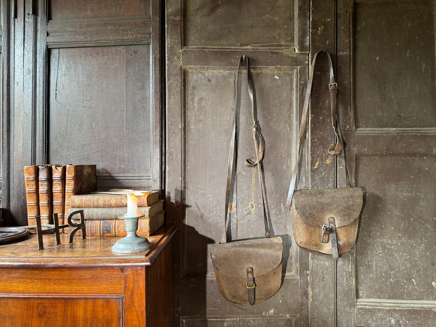 A pair of early 20th century leather despatch-type shoulder bags with original straps