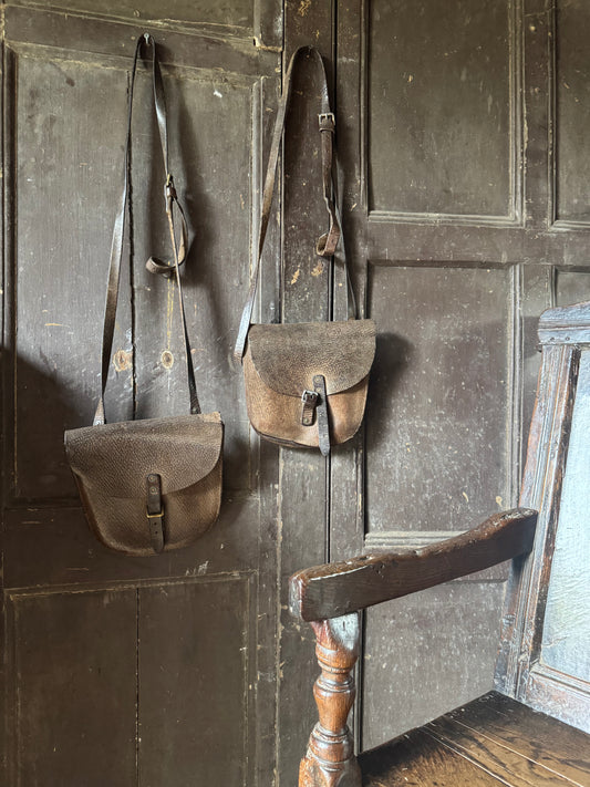 A pair of early 20th century leather despatch-type shoulder bags with original straps