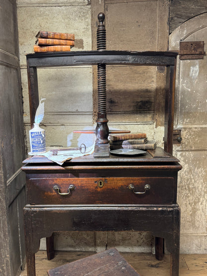 A provincial George III linen press with screw mechanism