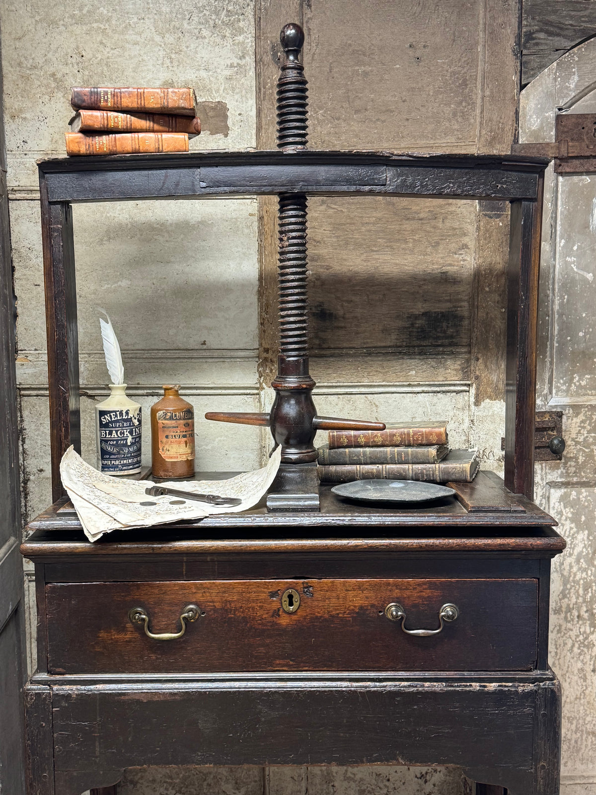 A provincial George III linen press with screw mechanism