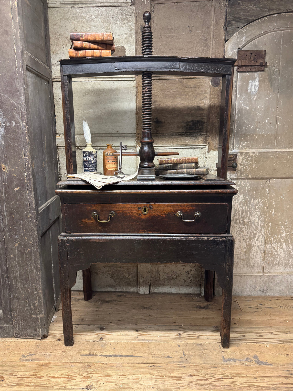 A provincial George III linen press with screw mechanism