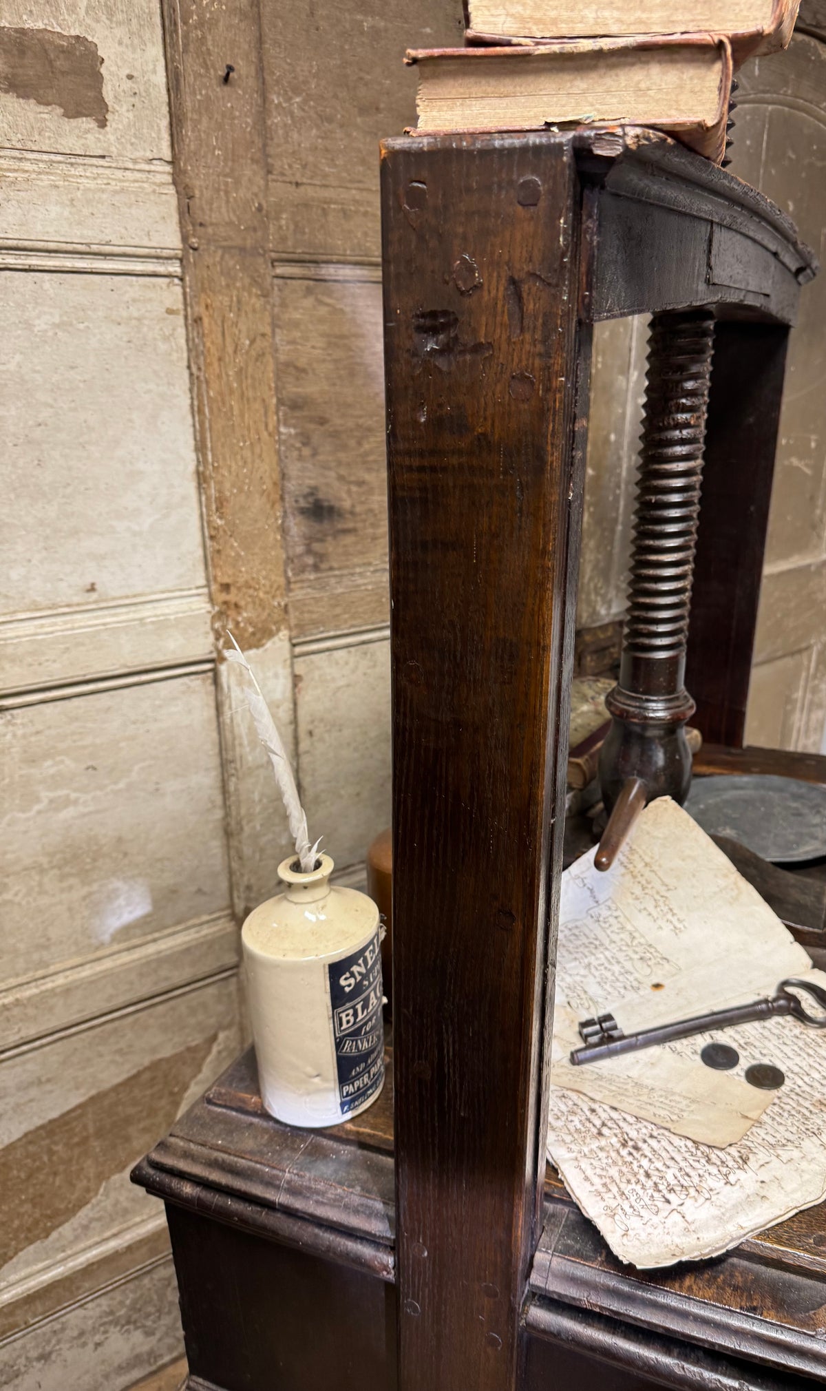 A provincial George III linen press with screw mechanism