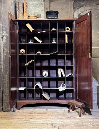 A slender Regency mahogany estate cabinet by repute from a Cambridge university college