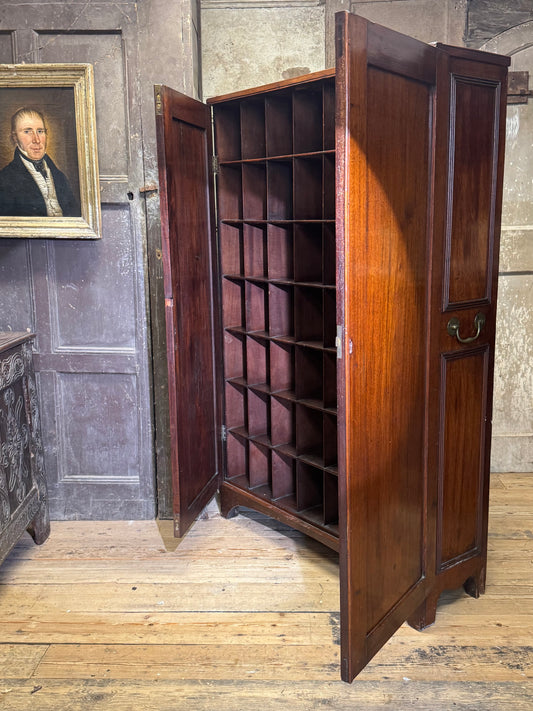 A slender Regency mahogany estate cabinet by repute from a Cambridge university college