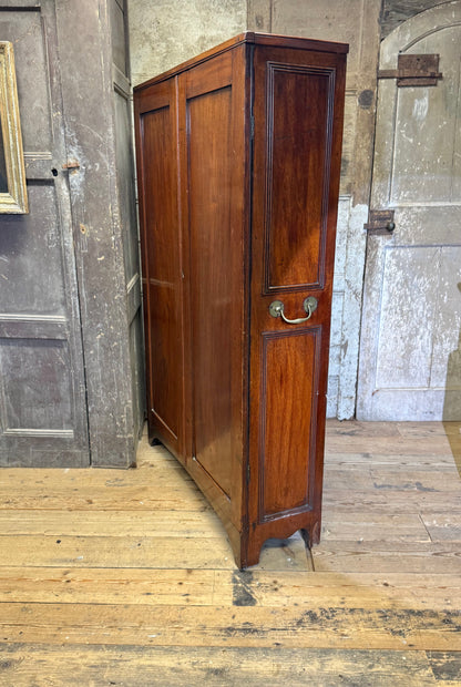 A slender Regency mahogany estate cabinet by repute from a Cambridge university college