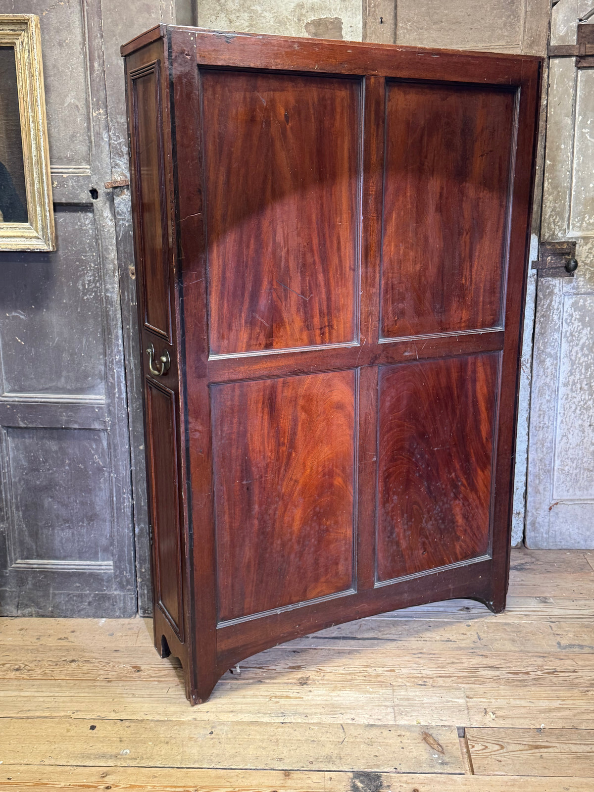 A slender Regency mahogany estate cabinet by repute from a Cambridge university college