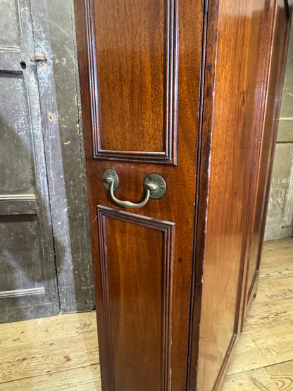 A slender Regency mahogany estate cabinet by repute from a Cambridge university college