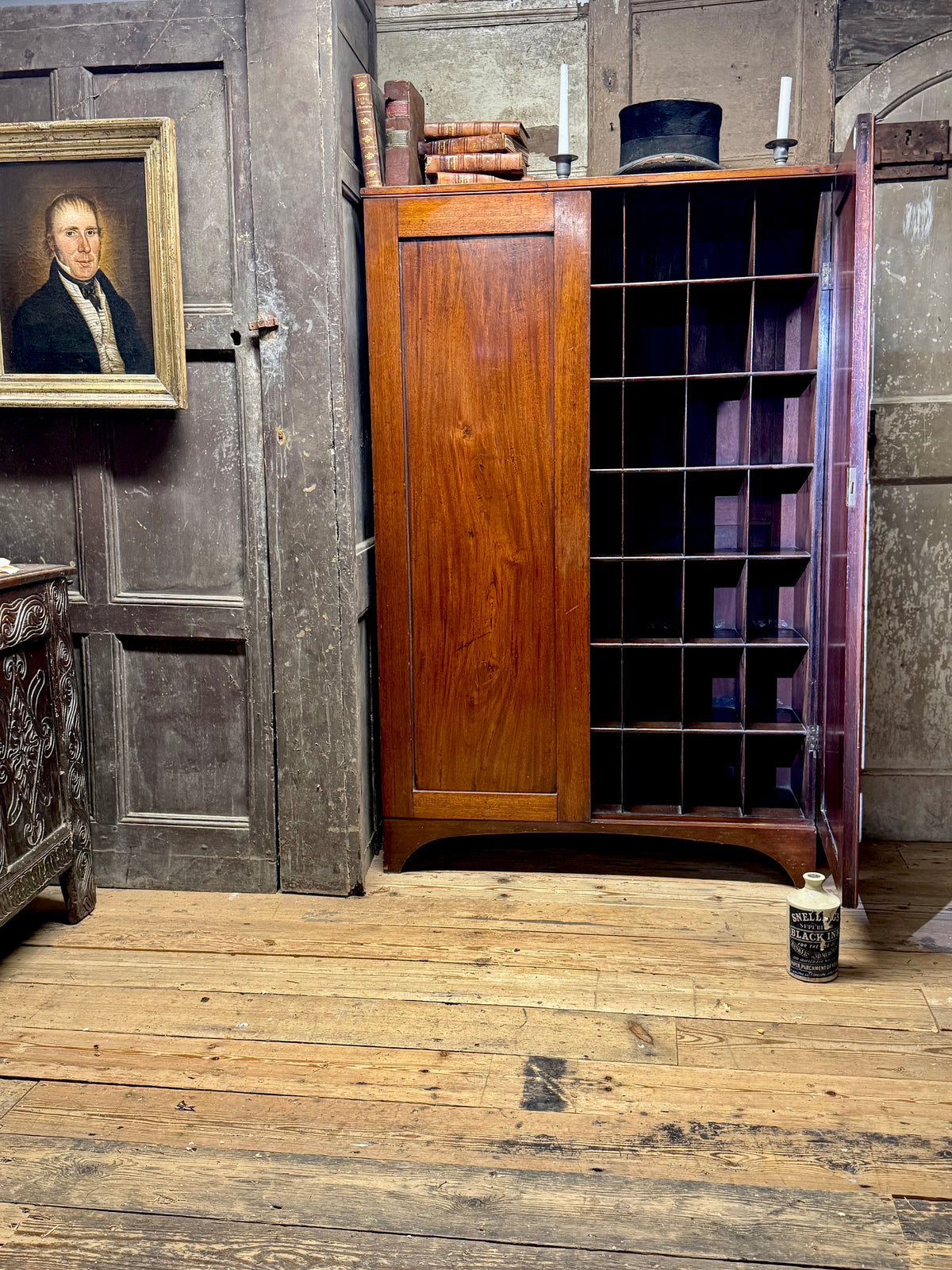 A slender Regency mahogany estate cabinet by repute from a Cambridge university college