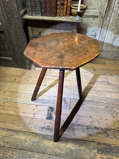 A George III primitive oak slab top octagonal cricket table of exceptional colour