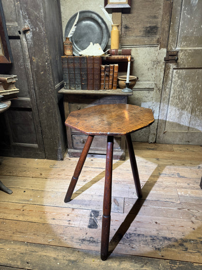 A George III primitive oak slab top octagonal cricket table of exceptional colour