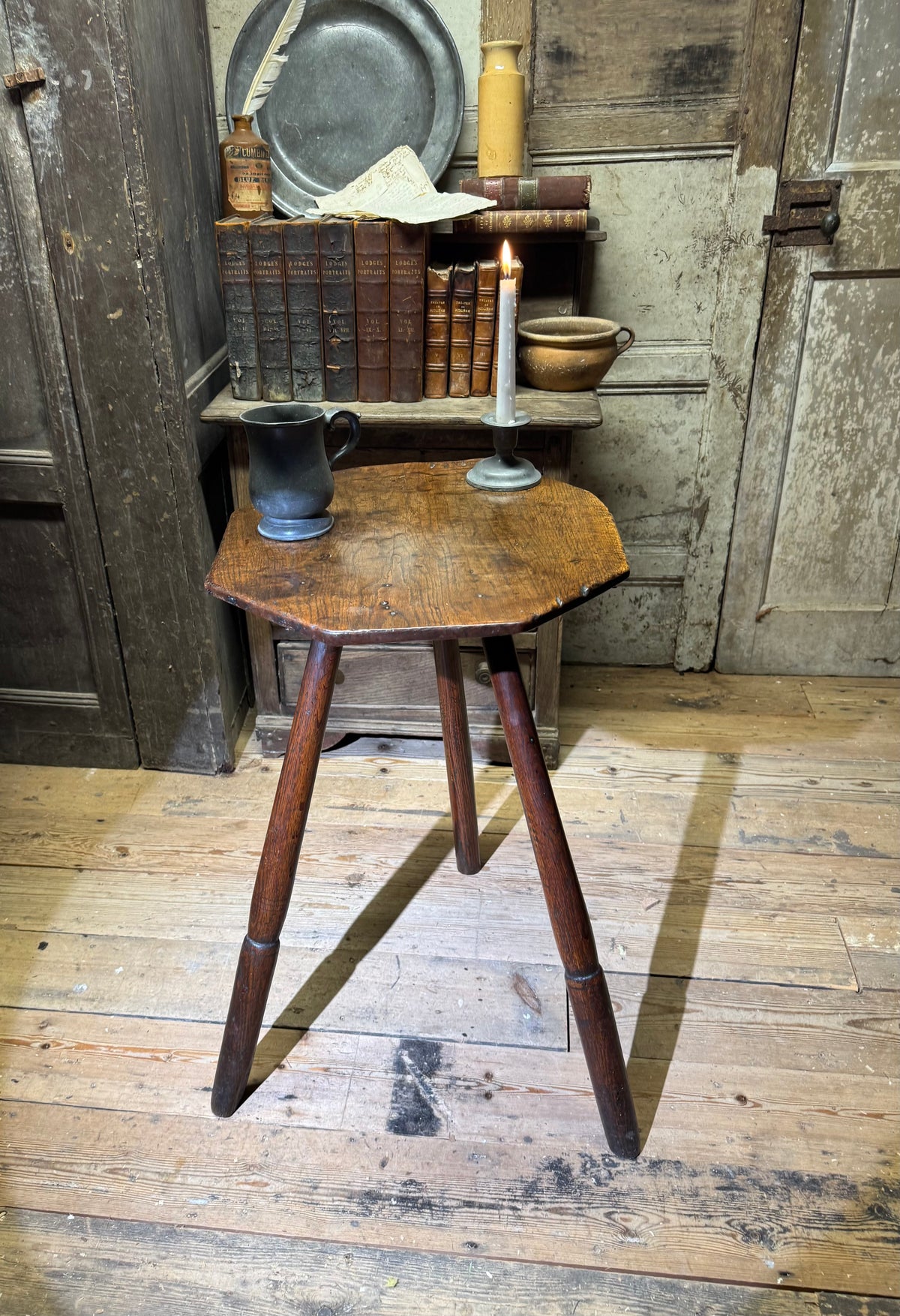A George III primitive oak slab top octagonal cricket table of exceptional colour