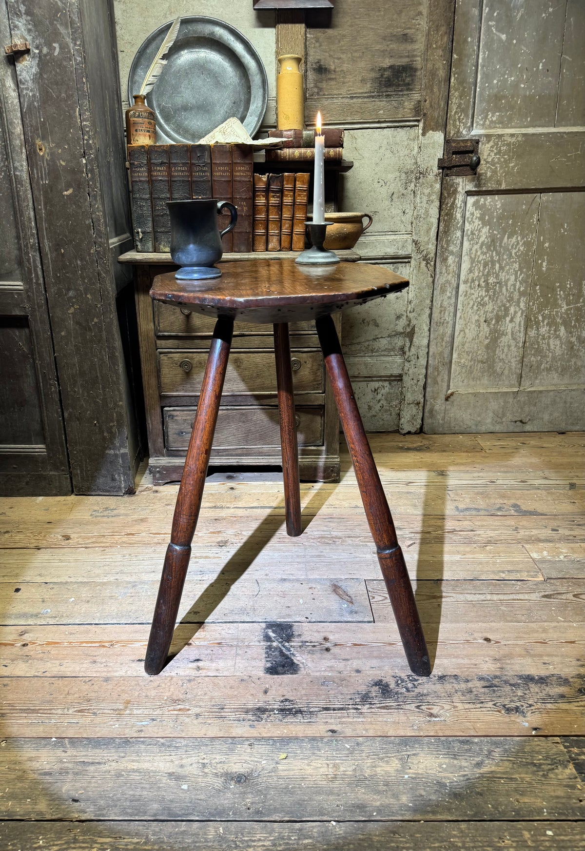 A George III primitive oak slab top octagonal cricket table of exceptional colour
