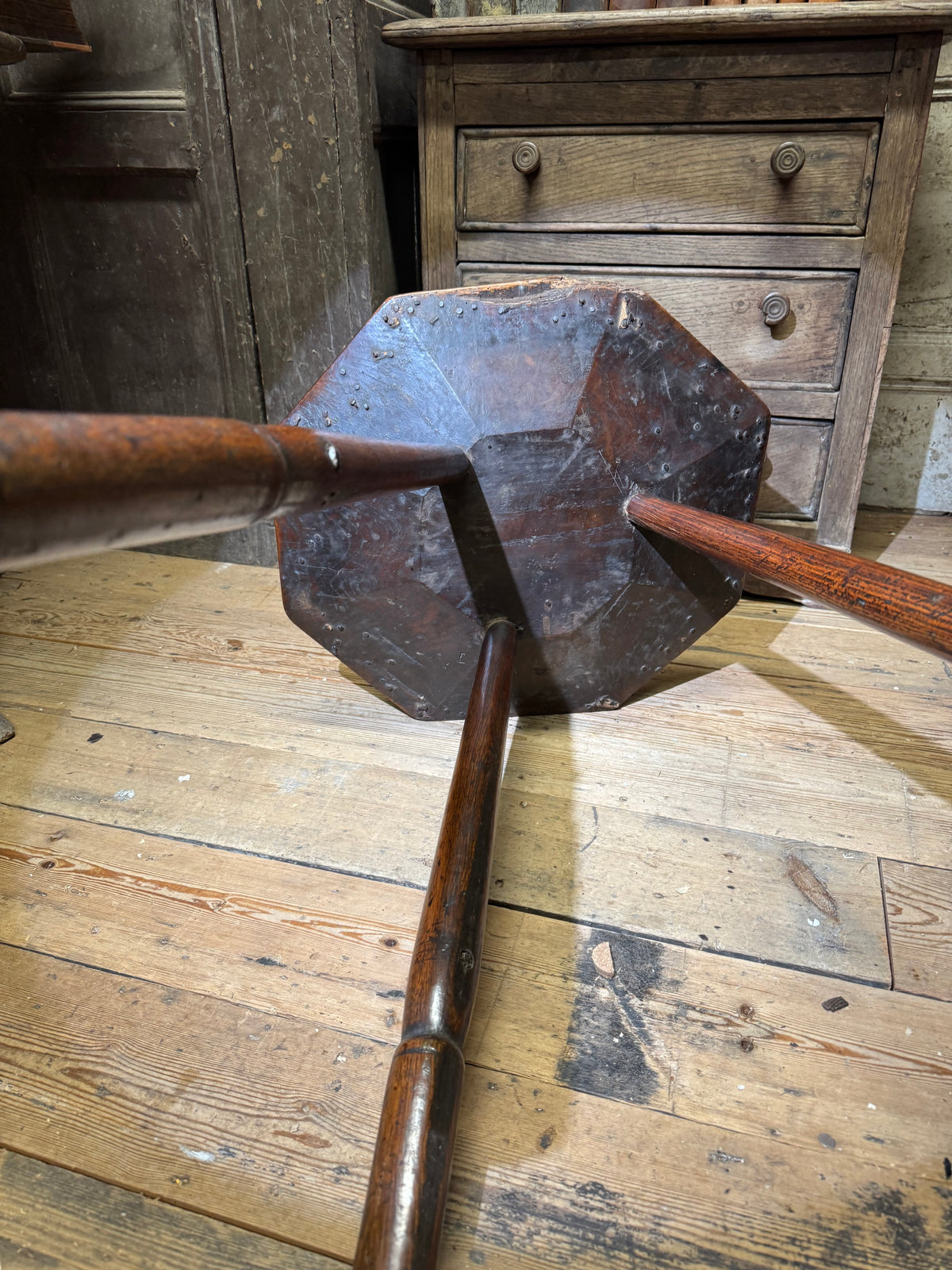 A George III primitive oak slab top octagonal cricket table of exceptional colour