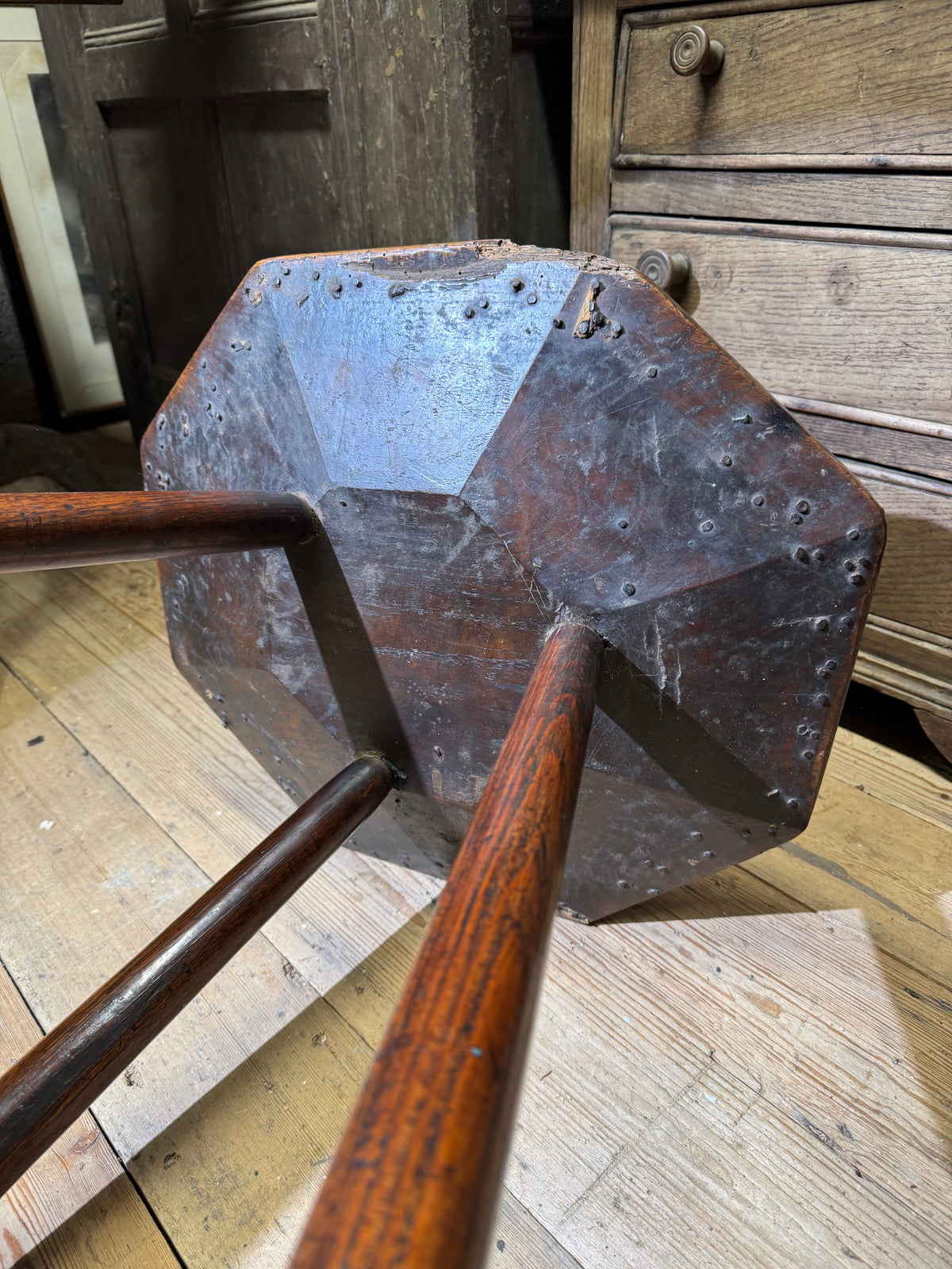 A George III primitive oak slab top octagonal cricket table of exceptional colour