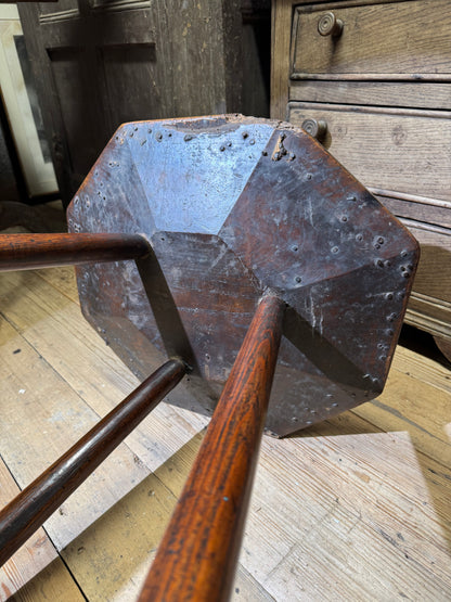 A George III primitive oak slab top octagonal cricket table of exceptional colour