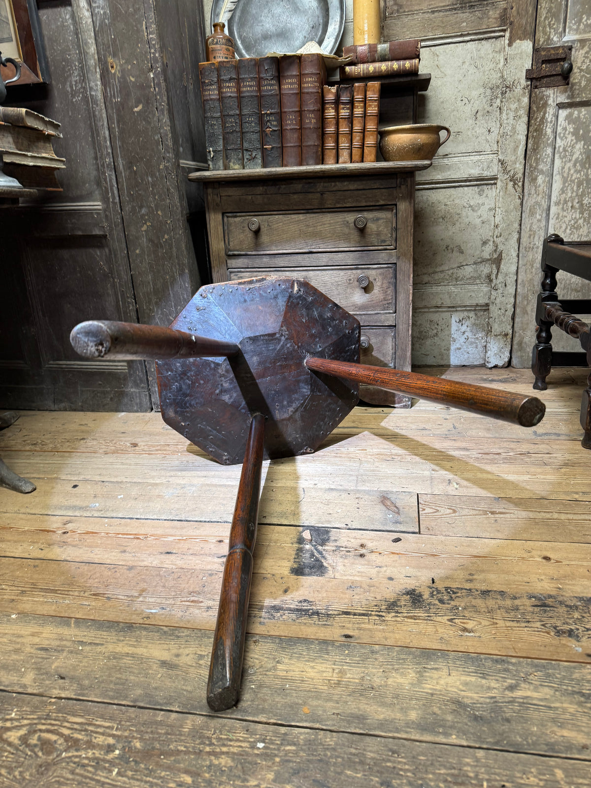 A George III primitive oak slab top octagonal cricket table of exceptional colour