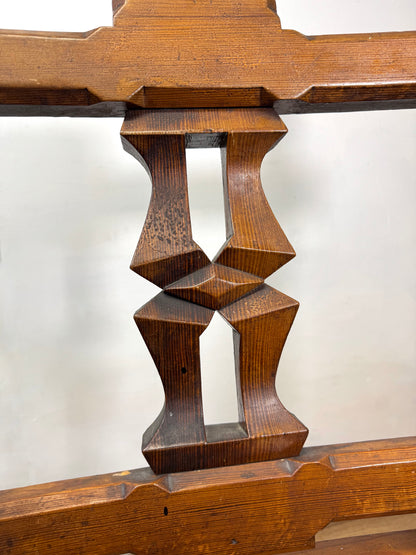 A pair of 19th century Welsh pitch pine chairs with unusual splats