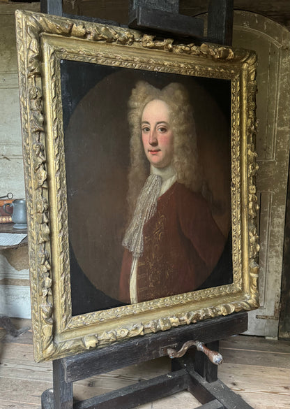 A fine early 18th century portrait of a gentleman in a crimson coat, circle of Joseph Highmore (1692-1780)