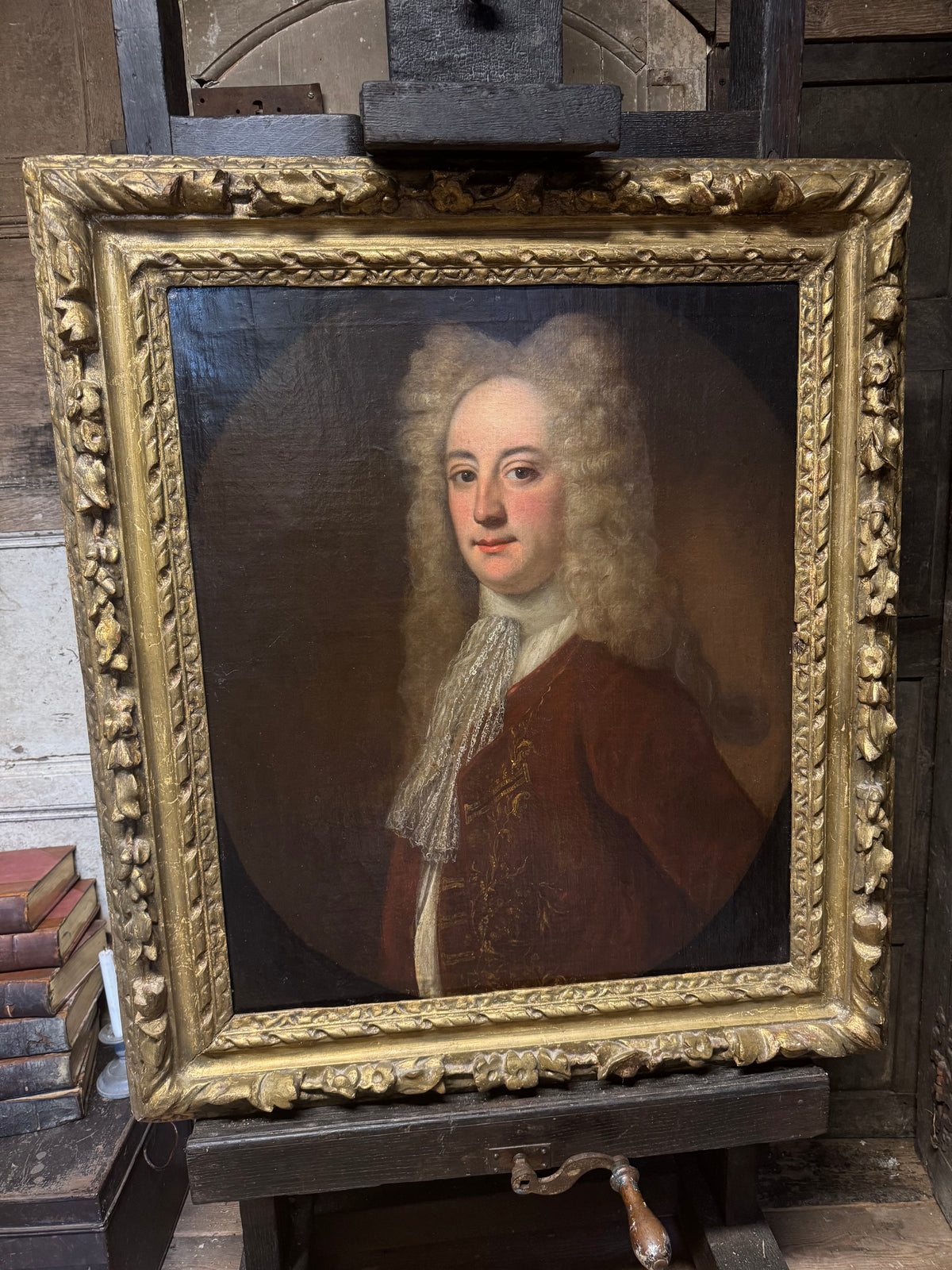 A fine early 18th century portrait of a gentleman in a crimson coat, circle of Joseph Highmore (1692-1780)