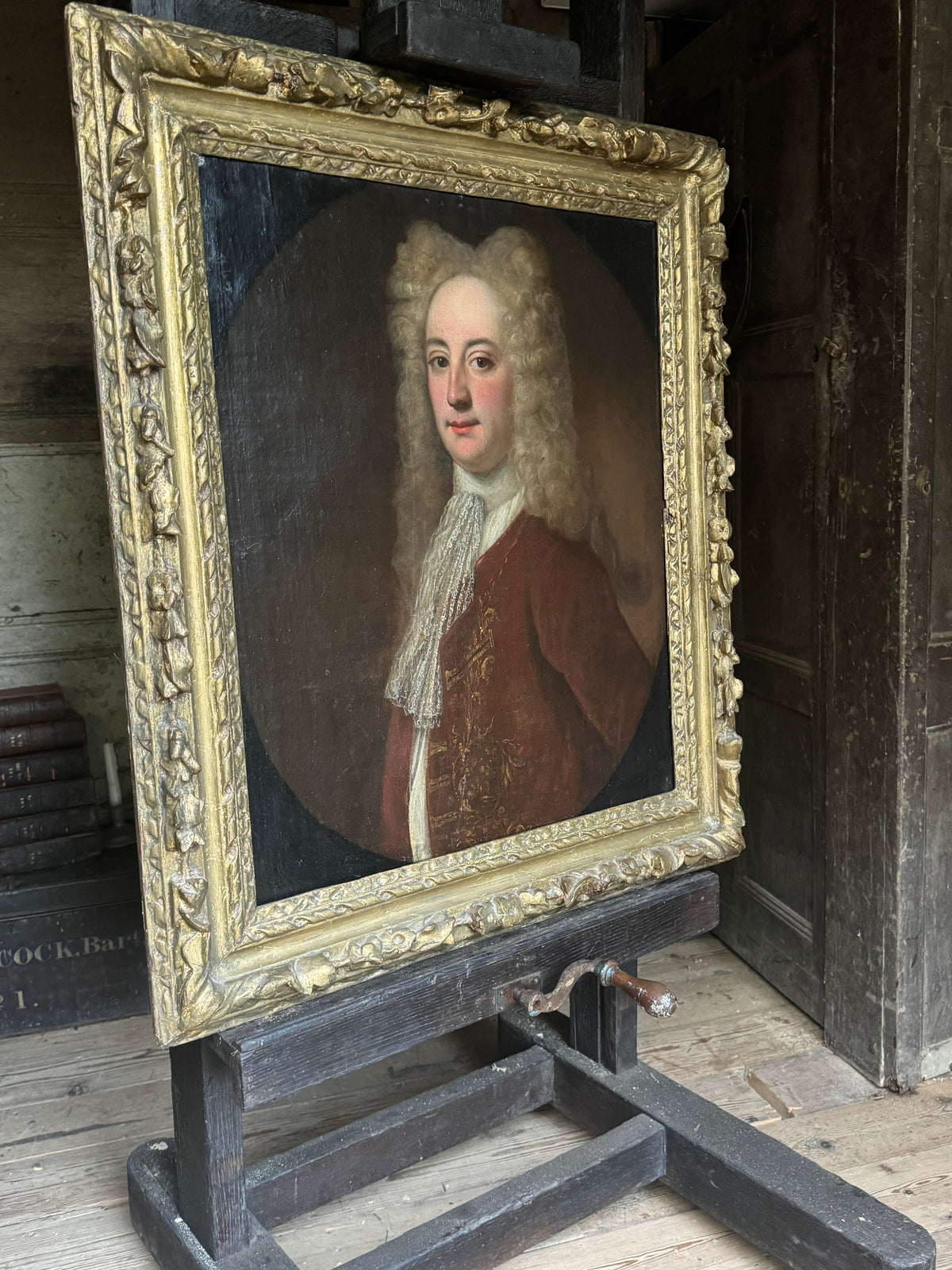 A fine early 18th century portrait of a gentleman in a crimson coat, circle of Joseph Highmore (1692-1780)