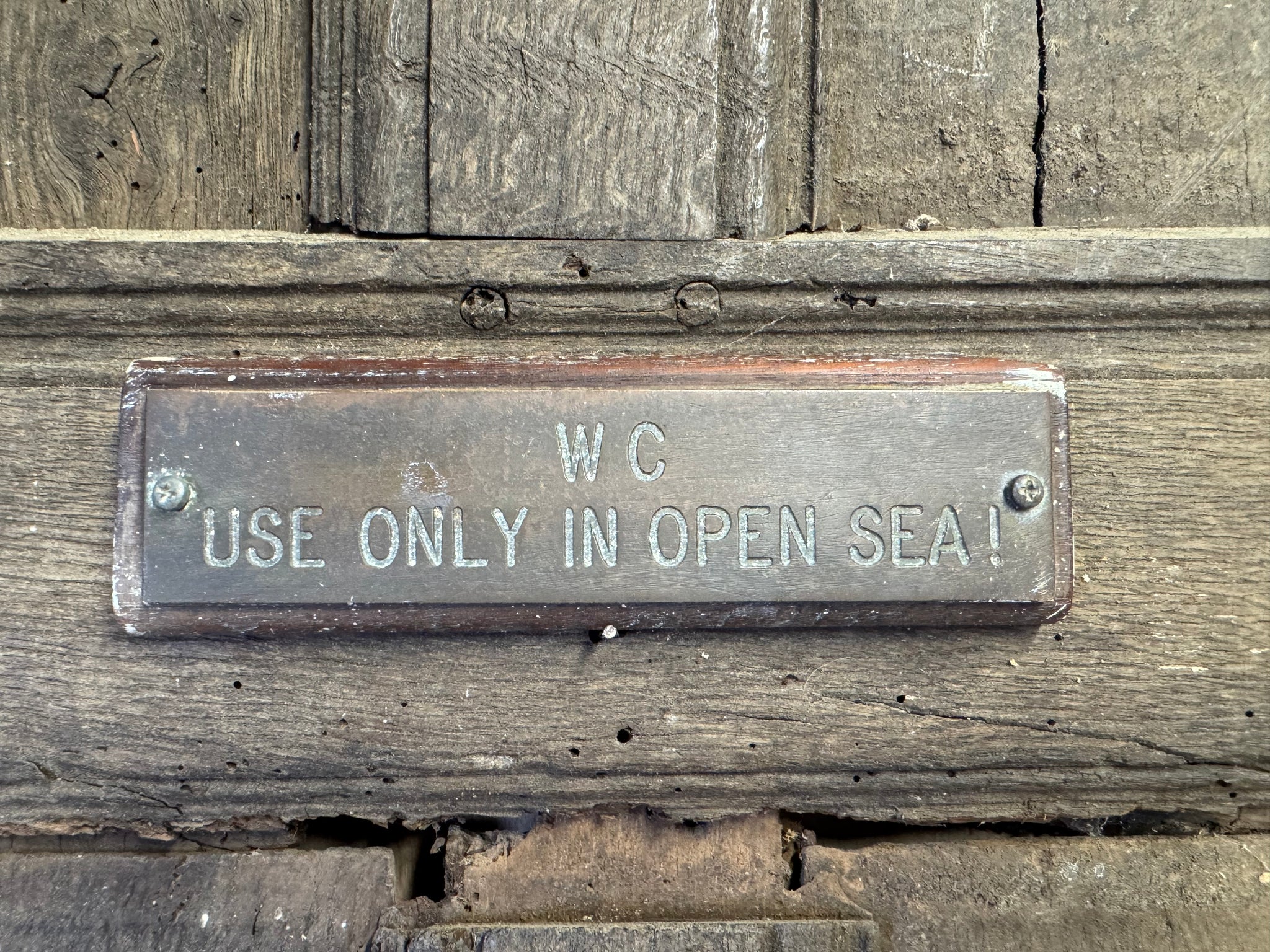 An English ship's sign "WC Use only in open sea" - Mostyn House School