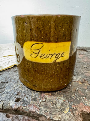 A slipware mug  for 'George'  by Isaac Button of Soil Hill, Halifax