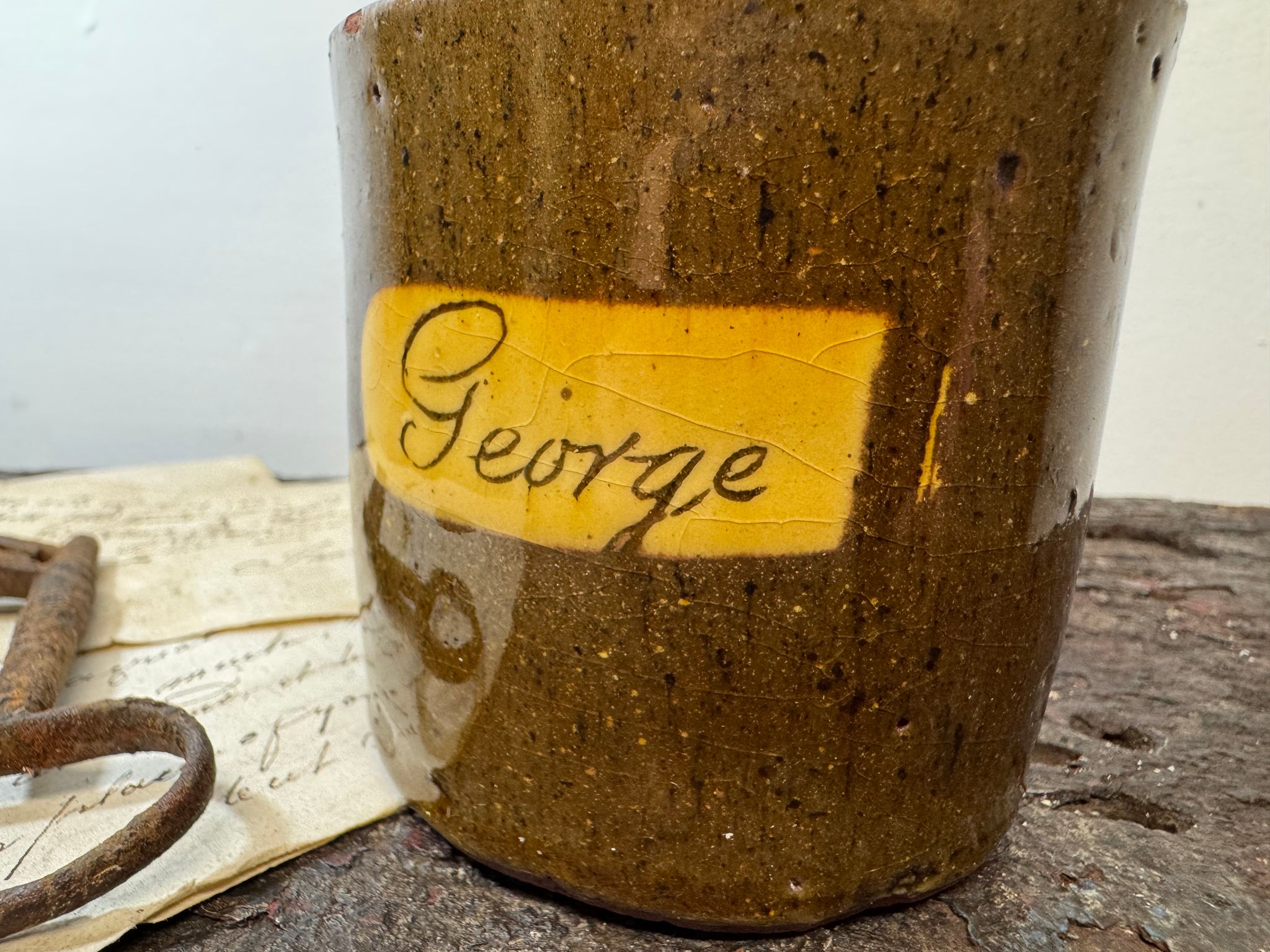 A slipware mug  for 'George'  by Isaac Button of Soil Hill, Halifax