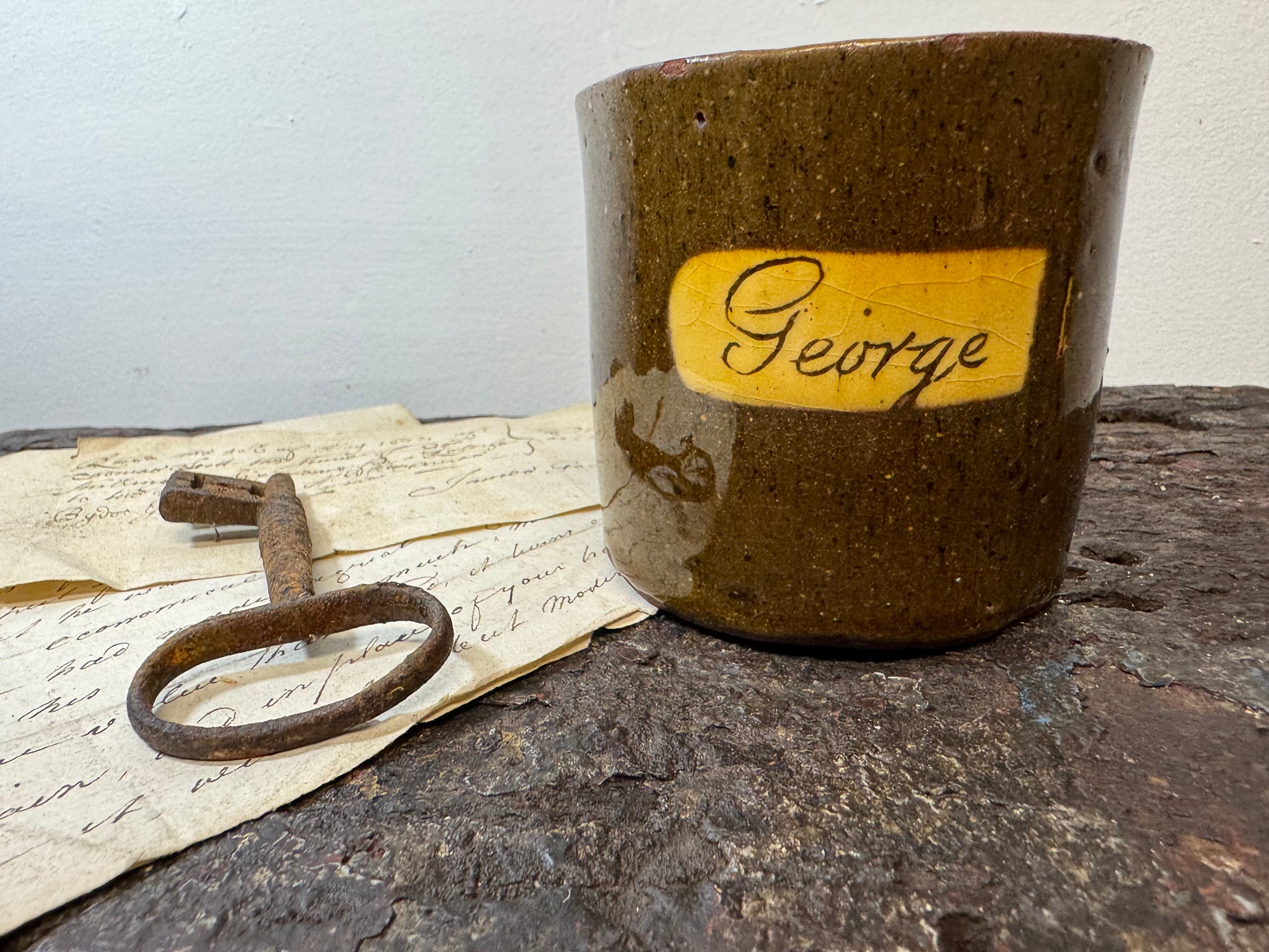 A slipware mug  for 'George'  by Isaac Button of Soil Hill, Halifax