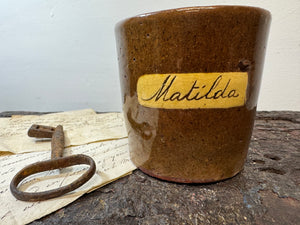 A slipware mug  for 'Matilda'  by Isaac Button of Soil Hill, Halifax