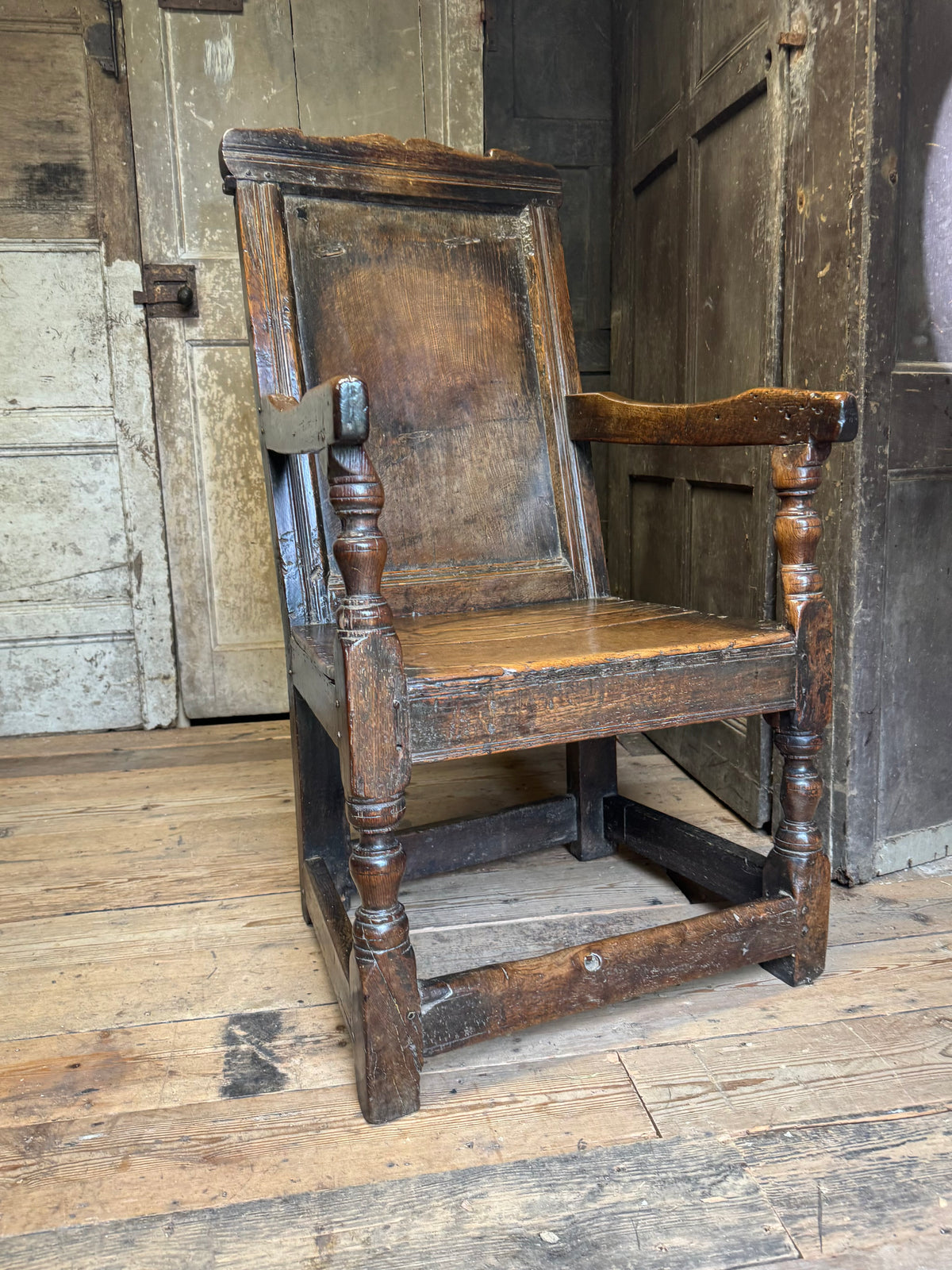 A North country 17th century oak wainscot armchair of excellent colour