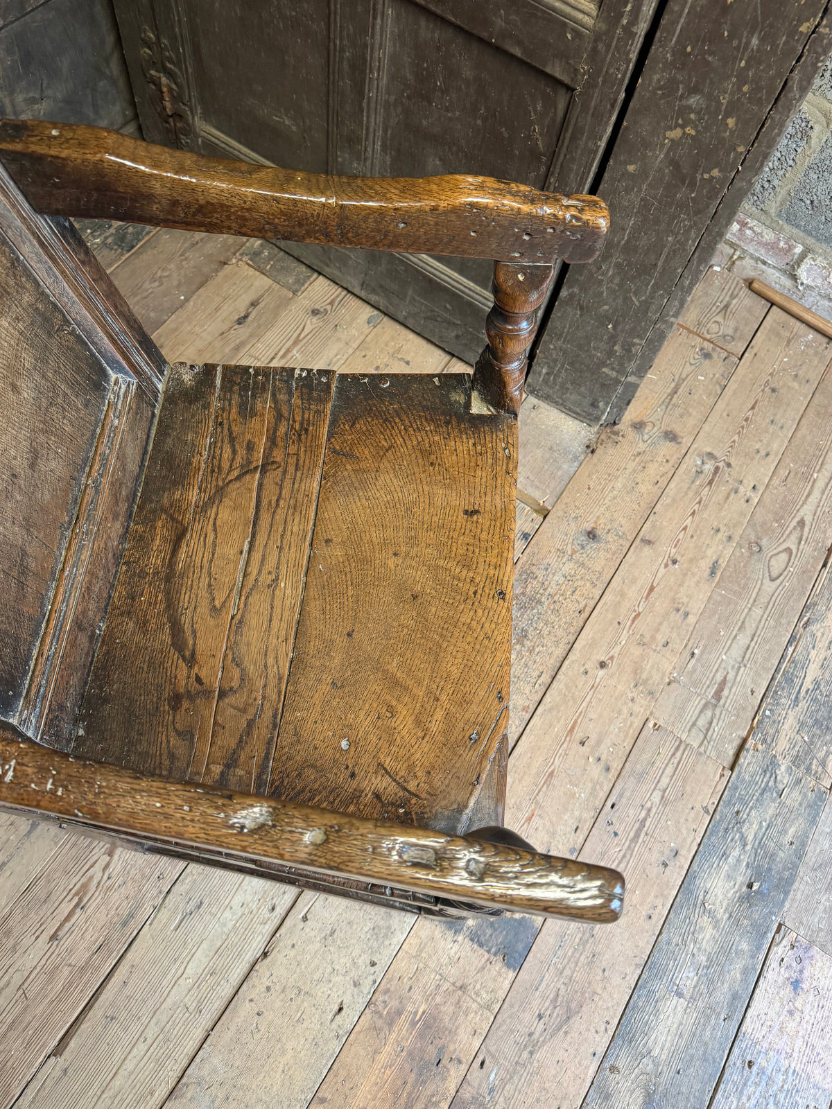 A North country 17th century oak wainscot armchair of excellent colour