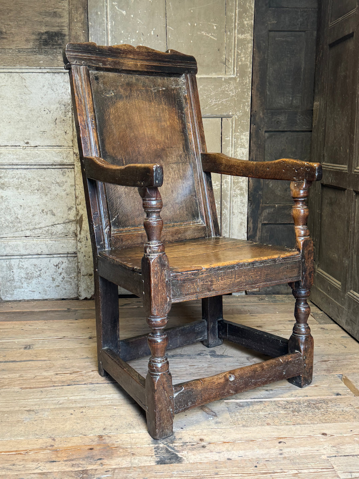 A North country 17th century oak wainscot armchair of excellent colour